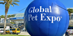 A large blue inflatable sphere with the words "Global Pet Expo" in white lettering.