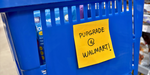 A blue shopping basket with a yellow sticky note that reads "PUPGRADE @ WALMART!"