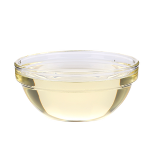 A clear glass bowl filled with a pale yellow liquid.