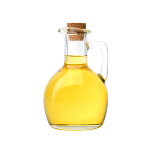 A clear glass bottle filled with golden yellow oil.
